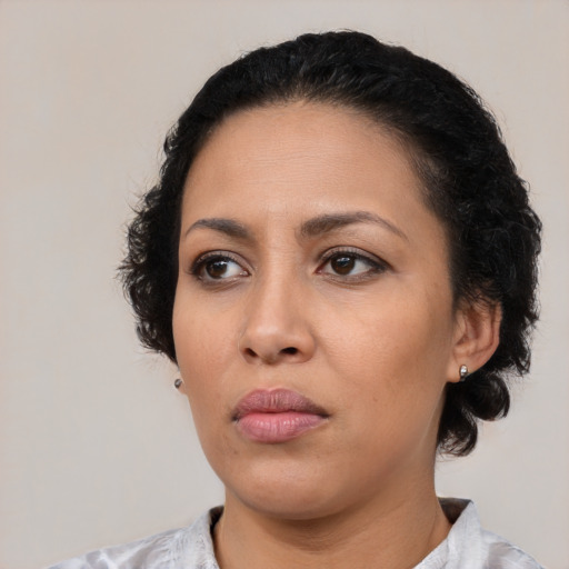 Neutral latino young-adult female with medium  black hair and brown eyes