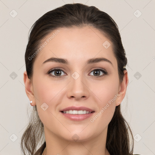 Joyful white young-adult female with long  brown hair and grey eyes