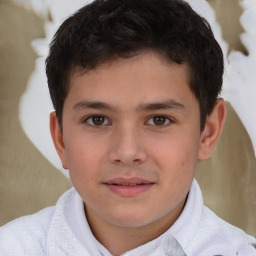 Joyful white child male with short  brown hair and brown eyes