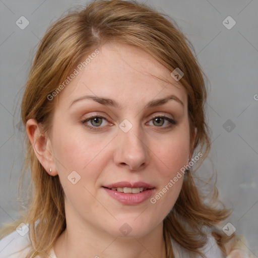 Joyful white young-adult female with medium  brown hair and blue eyes