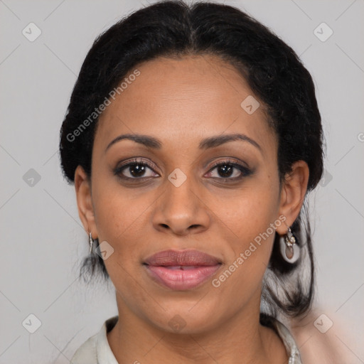 Joyful black adult female with medium  black hair and brown eyes