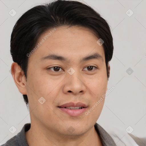 Joyful asian young-adult male with short  brown hair and brown eyes