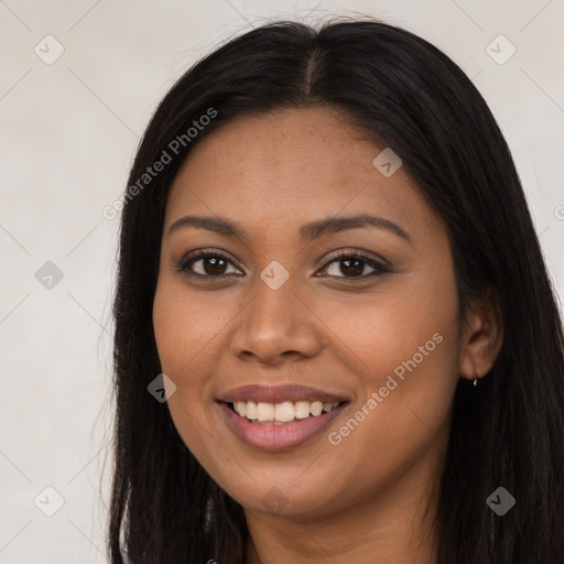 Joyful latino young-adult female with long  brown hair and brown eyes