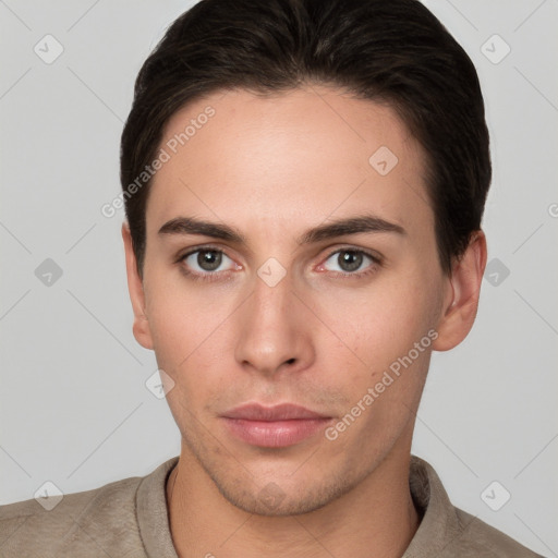 Neutral white young-adult male with short  brown hair and brown eyes