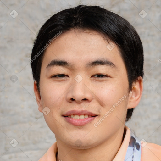 Joyful asian young-adult male with short  black hair and brown eyes