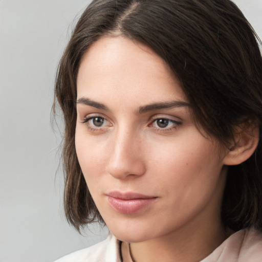 Neutral white young-adult female with medium  brown hair and brown eyes