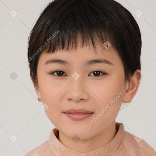 Joyful asian child female with short  brown hair and brown eyes