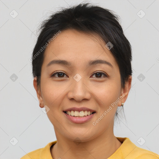 Joyful asian young-adult female with short  brown hair and brown eyes