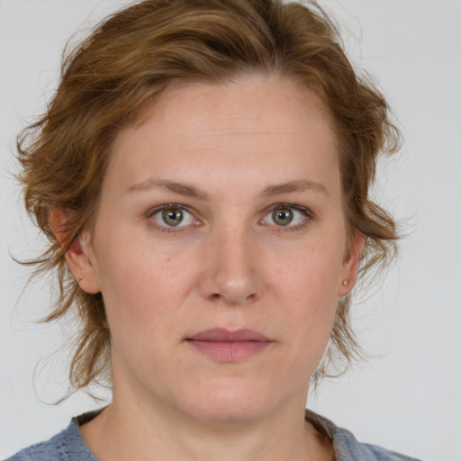 Joyful white young-adult female with medium  brown hair and blue eyes