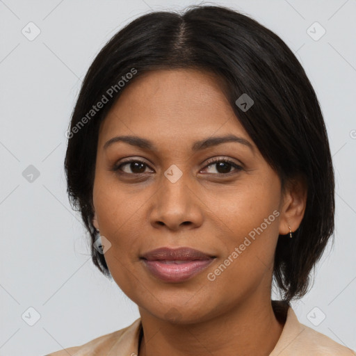 Joyful latino adult female with medium  brown hair and brown eyes