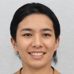 Joyful asian young-adult female with medium  black hair and brown eyes