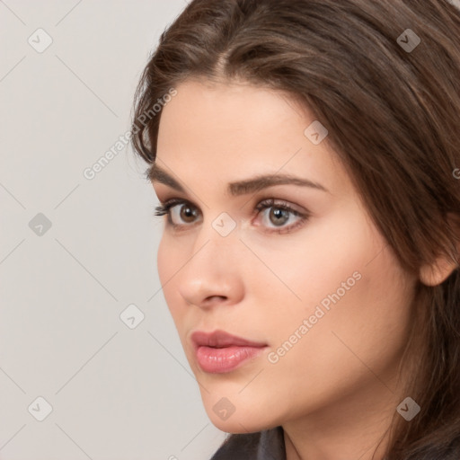 Neutral white young-adult female with long  brown hair and brown eyes