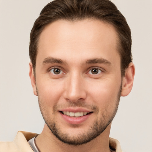 Joyful white young-adult male with short  brown hair and brown eyes