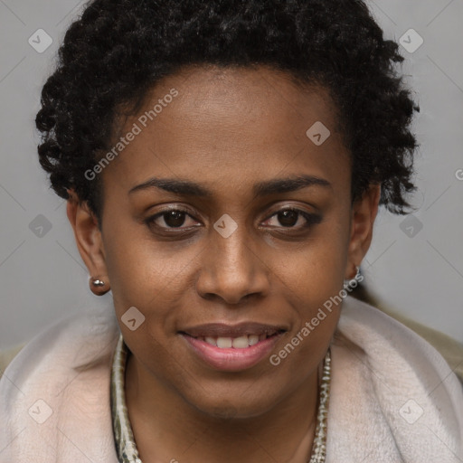 Joyful black young-adult female with short  brown hair and brown eyes