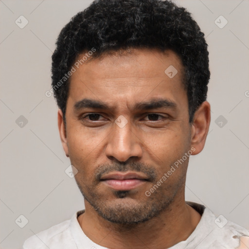 Neutral latino adult male with short  black hair and brown eyes