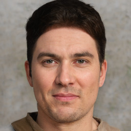 Joyful white adult male with short  brown hair and grey eyes