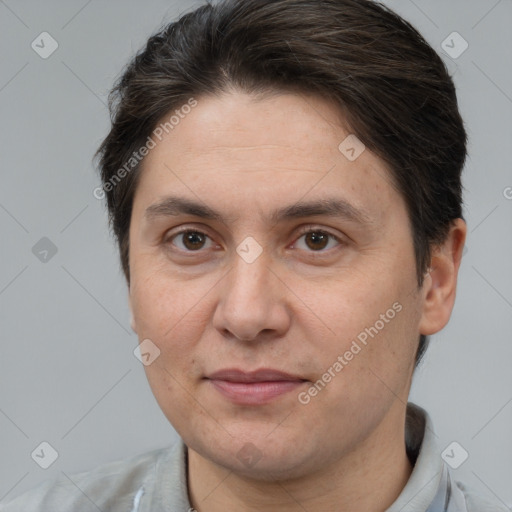 Joyful white adult female with short  brown hair and brown eyes