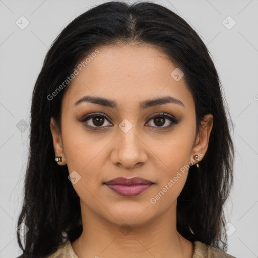 Joyful latino young-adult female with long  brown hair and brown eyes