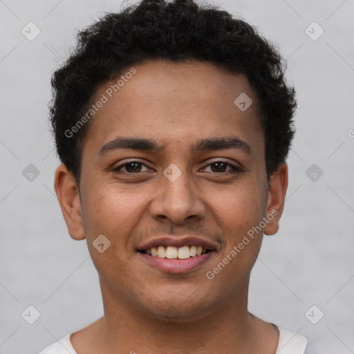 Joyful latino young-adult male with short  brown hair and brown eyes