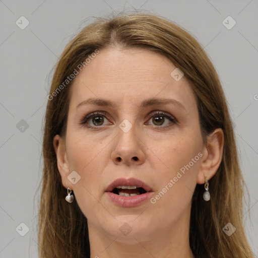 Joyful white adult female with long  brown hair and grey eyes