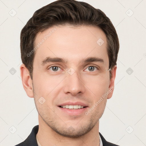 Joyful white young-adult male with short  brown hair and grey eyes