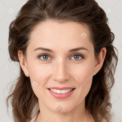 Joyful white young-adult female with medium  brown hair and green eyes