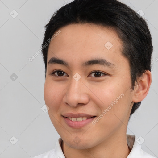 Joyful asian young-adult male with short  black hair and brown eyes