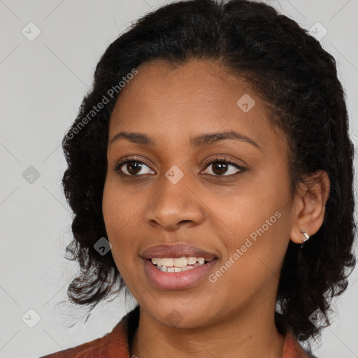 Joyful black young-adult female with medium  brown hair and brown eyes