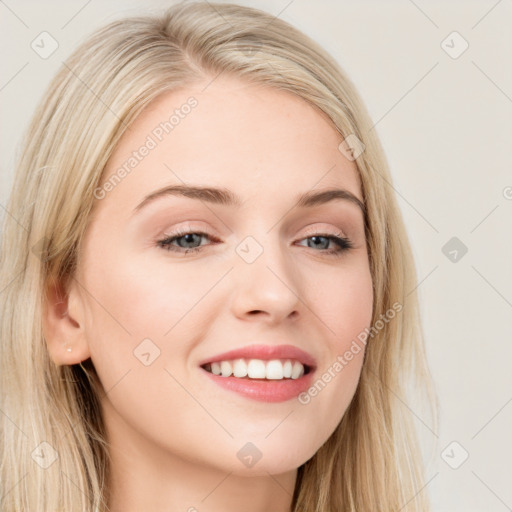 Joyful white young-adult female with long  brown hair and blue eyes