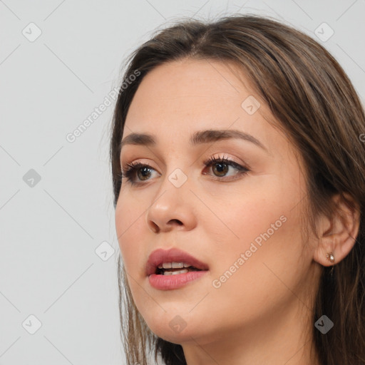 Neutral white young-adult female with long  brown hair and brown eyes