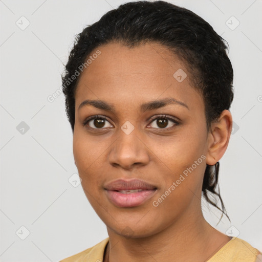 Joyful latino young-adult female with short  black hair and brown eyes