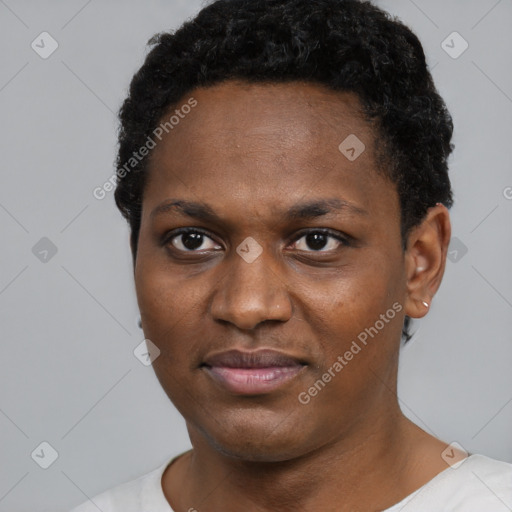 Joyful black young-adult female with short  black hair and brown eyes