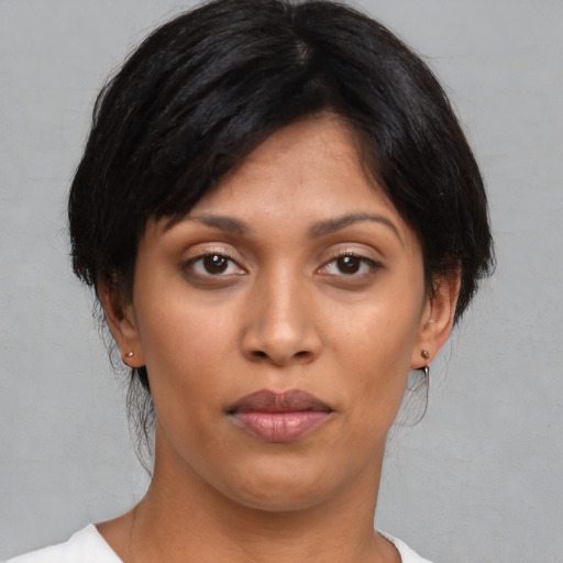 Joyful asian young-adult female with medium  black hair and brown eyes