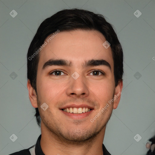 Joyful white young-adult male with short  black hair and brown eyes