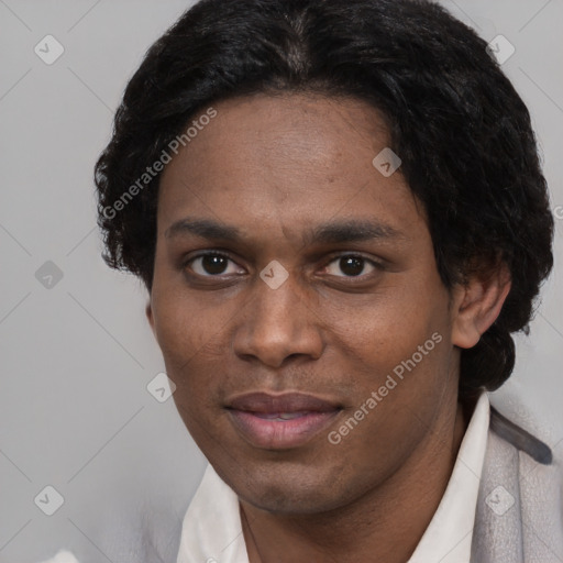 Joyful black adult male with short  black hair and brown eyes