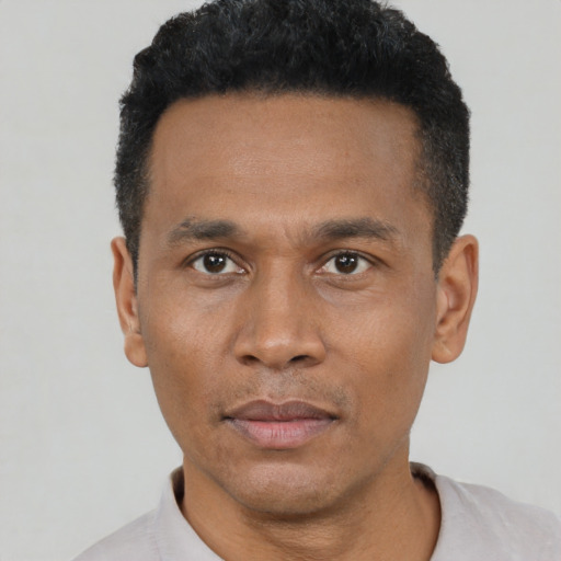 Neutral black young-adult male with short  black hair and brown eyes