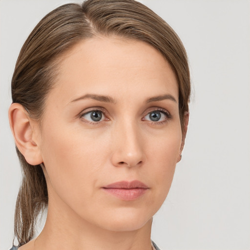 Neutral white young-adult female with medium  brown hair and grey eyes