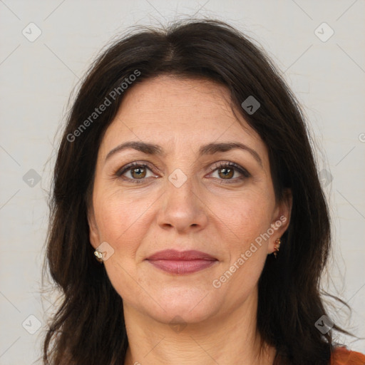 Joyful white adult female with medium  brown hair and brown eyes