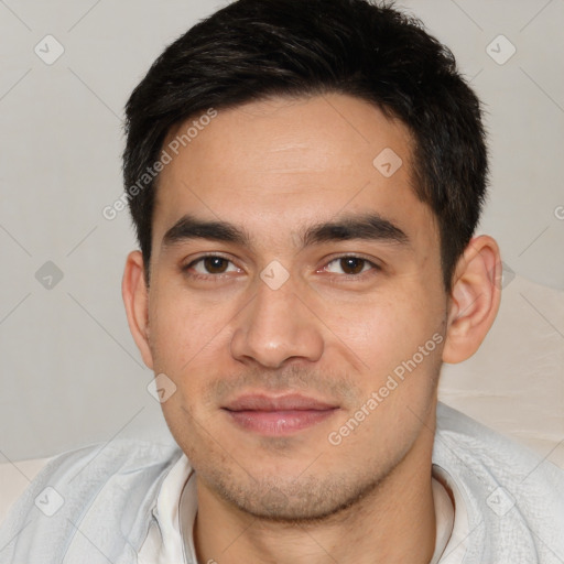 Joyful white young-adult male with short  black hair and brown eyes