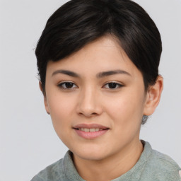 Joyful asian young-adult female with short  black hair and brown eyes