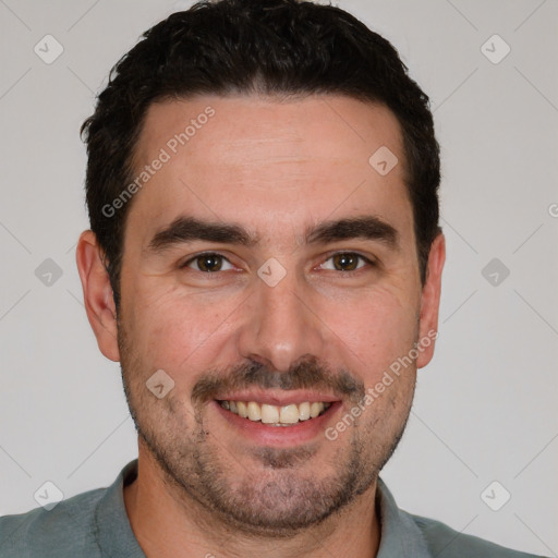 Joyful white young-adult male with short  black hair and brown eyes