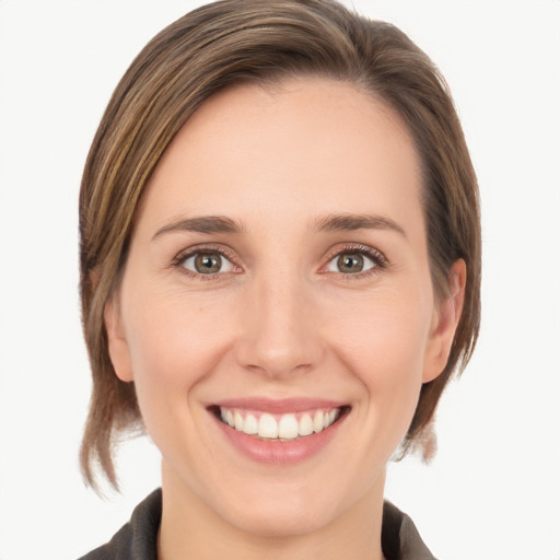 Joyful white young-adult female with medium  brown hair and grey eyes