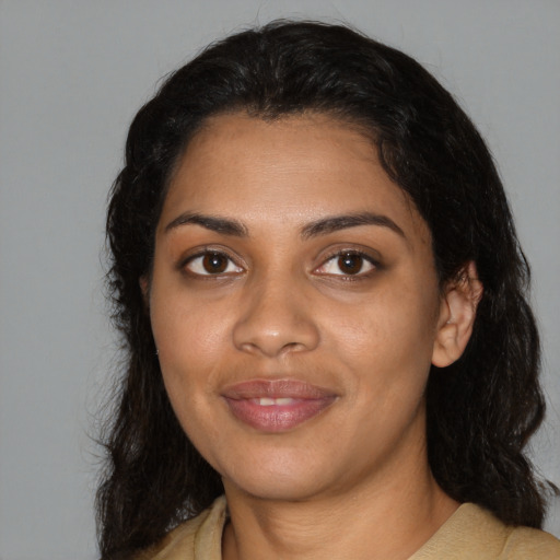 Joyful black young-adult female with medium  black hair and brown eyes