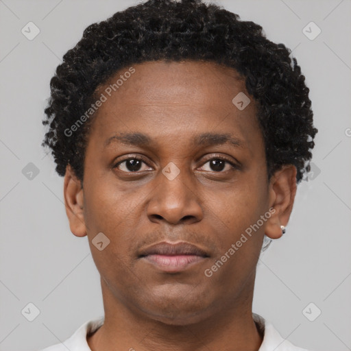 Neutral latino young-adult male with short  brown hair and brown eyes