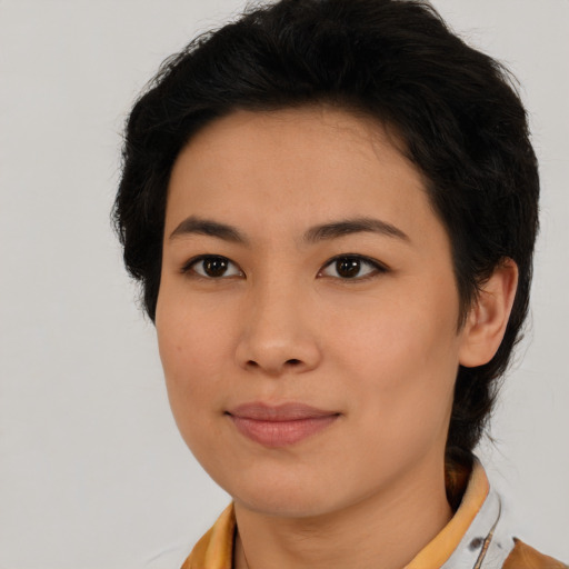 Joyful latino young-adult female with medium  black hair and brown eyes