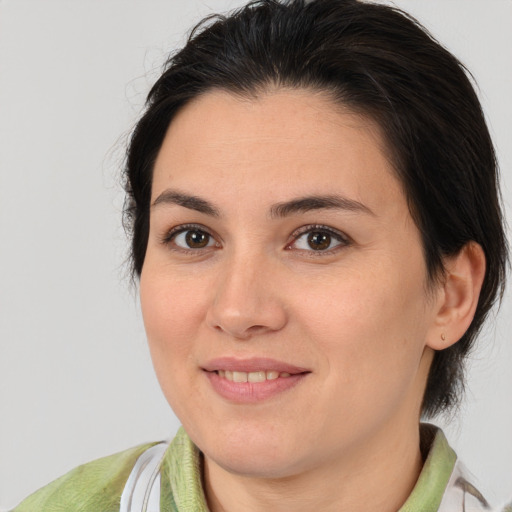 Joyful white young-adult female with medium  brown hair and brown eyes