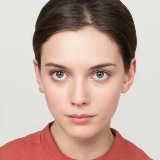 Neutral white young-adult female with short  brown hair and brown eyes