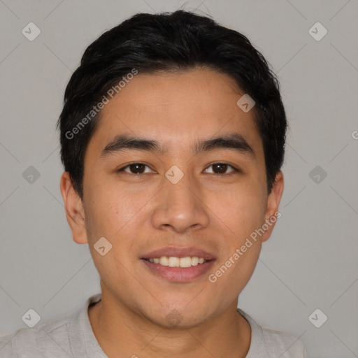 Joyful latino young-adult male with short  black hair and brown eyes