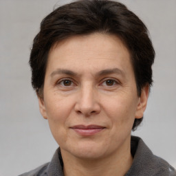 Joyful white adult female with short  brown hair and brown eyes