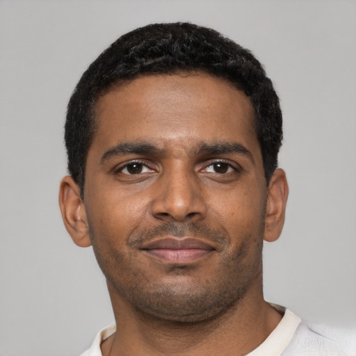 Neutral black young-adult male with short  black hair and brown eyes